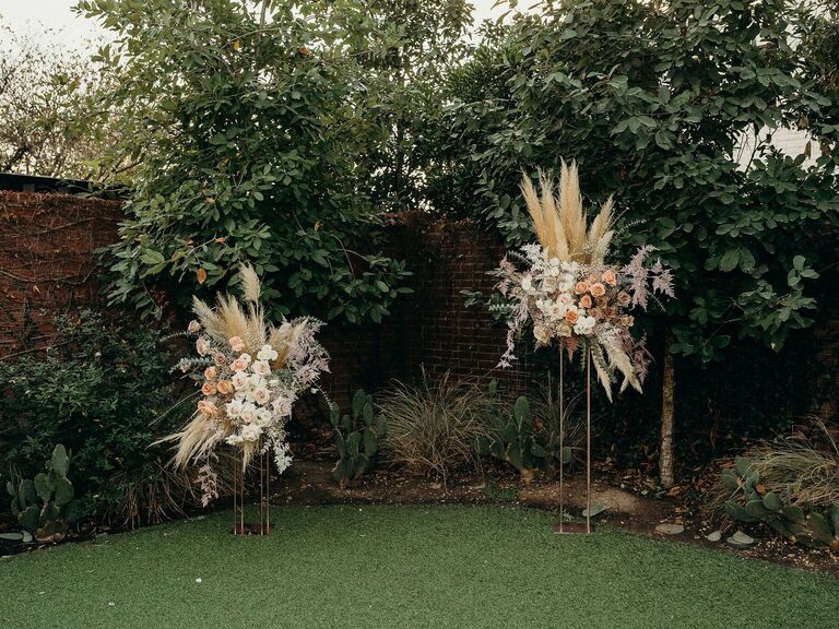 Two-piece wedding arch at a backyard wedding