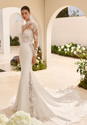 Mermaid silhouette wedding dress with sweetheart neckline, long sleeve with beaded lace, beaded lace bodice, closed back and train.