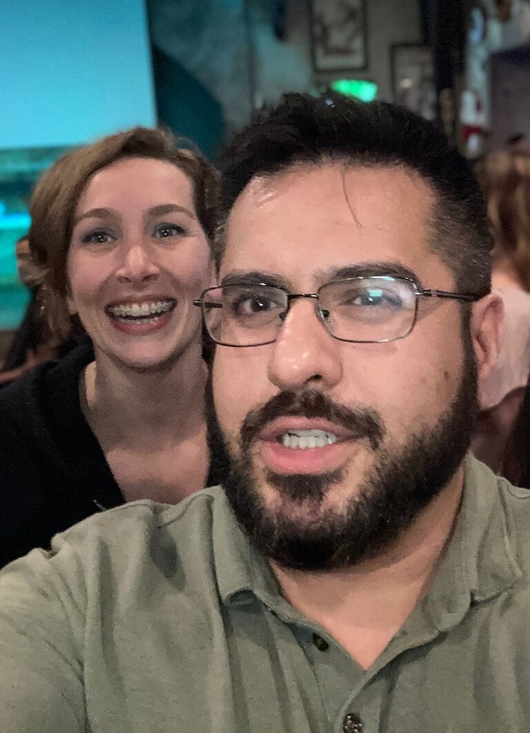 a handsome guy works up the courage to chat with a gal. they conquer a trivia game and become fast friends - encapsulating the fated night in a photograph!
